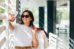 A girl is taking selfie with sunglasses, after onl;ine shopping of sunglasses at Vazeer optical hall